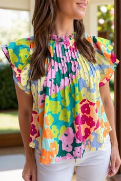 Features: Ruffled Sheer: Opaque Stretch: No stretch Material composition: 100% polyester Care instructions: Machine wash cold. Tumble dry low. Imported Size US Bust Shoulder Sleeve Length Top Length S 4 39.8 12.8 4.9 23.6 M 6/8 42.1 13.4 4.9 24.4 L 10/12 44.5 14 4.9 25.2 XL 14/16 47.6 14.8 4.9 26 Flutter Sleeve Blouse, Cap Sleeve Blouse, Stand Neck, Cap Sleeves Blouse, Pleated Sleeves, Stylish Blouse, Pleated Blouse, Abstract Print, Flutter Sleeve