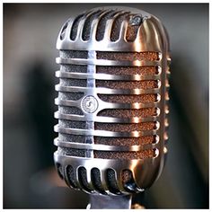 an old fashioned microphone with some lights on it