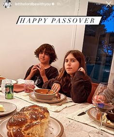 two people sitting at a table with plates of food in front of them and the words happy passover written on it