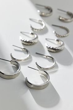 Staple hoop earrings in a set of five pairs in graduated sizes complete with post backings. Features Ebbie hoop earring set Set of five pairs of hoop earrings Graduated sizes from small hoops to large hoop earrings In silver or gold metal Post backings Content + Care Set of 5 pairs Mixed metal Avoid contact with water Imported | Ebbie Hoop Earring Set in Silver, Women's at Urban Outfitters Silver Hypoallergenic Hoop Earrings For Festivals, Affordable Silver Hoop Earrings For Streetwear, Silver Hypoallergenic Metal Hoop Earrings, Urban Outfitters Hoop Jewelry, Silver Hoop Earrings For Streetwear, Nickel-free Silver Alloy Hoop Earrings, Hoop Earring Sets, Concert Fits, Brand Sale