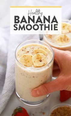 two glasses filled with smoothie and topped with banana slices