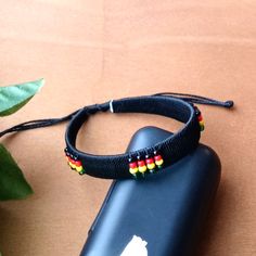 1pc Beautiful African Rasta Black Threaded Bracelet. Adjustable Black Beaded Friendship Bracelets, Black Beaded Choker For Beach, Black Beaded Beach Choker, Casual Black Friendship Bracelet With Black Beads, Handmade Black Braided Bracelets For Beach, Adjustable Black Bracelet With Band, Adjustable Black Festival Jewelry, Black Bracelet With Adjustable Band, Adjustable Black Friendship Bracelet