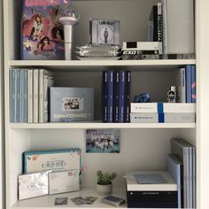 a book shelf filled with books and other items