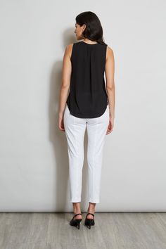 Luxurious Georgette elevates this minimalist top. Its split neckline and soft shoulder pleat detail add a touch of feminine flair. This essential piece will take you from Spring into Fall. T-Tahari Sleeveless Split Neck Georgette Shirt Relaxed Fit; Runs true to size. Model is 5'9" and wearing size S Imported Style #: THF41048 Elegant Sleeveless Tops For Business Casual, Versatile Sleeveless Top For Business Casual, Sleeveless Blouse For Business Casual, Sleeveless Business Casual Blouse, Sleek Sleeveless Workwear Top, Sleek Sleeveless Top For Workwear, Sleek Sleeveless Top For Work, Viscose Sleeveless Blouse Tank Top For Work, Sleeveless Viscose Tank Top For Work