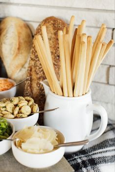 bread sticks and other food items on a table