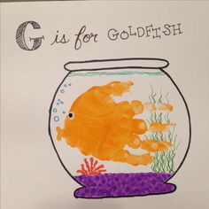 a child's drawing of a fish in a bowl with the words g is for goldfish