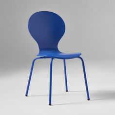 a blue chair sitting on top of a white floor