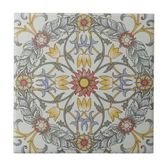 an artistic tile design in yellow, blue and grey colors with flowers on the center