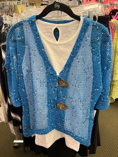 Vibrant Blue with black and white speckle color Mid-length sleeve 2 Over-Size Buttons Perfect cardigan for many dresses or tank tops Size Recommendation: Size down 1 size in this cardigan Sizing Size Dress Size Bust Waist Hips XS 4 34"-35" 26"-27" 37"-38" S 6-8 36"-37" 28"-29" 39"-40" M 8-10 38"-39" 30"-31" 41"-42" L 12-14 40"-41" 32"-33" 43"-44" XL 16 42"-43" 34"-35" 45"-46" 1X 18 44"-45" 36"-37" 47"-48" Lulu-B Clothing was started from a small family business that was founded in 1977 in South Blue Open Knit V-neck Sweater, One Size Blue Trendy Cardigan, Trendy Blue One Size Cardigan, Trendy Blue Cardigan, Blue V-neck Sweater For Summer, Blue V-neck Summer Sweater, Blue Knit Cardigan For Spring, Fitted Blue Open Knit Cardigan, Fitted Blue Summer Cardigan