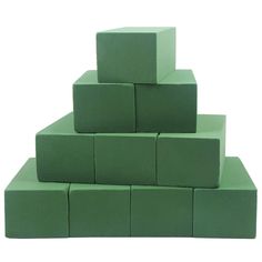 a stack of green cubes sitting on top of each other