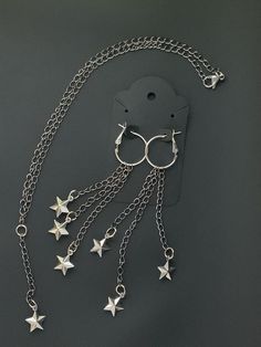 ✨💫 Make a wish and adorn yourself with the magic of the night sky! Introducing our enchanting "Wish Upon a Star" Hoop Dangle Earring and Necklace Combo, a celestial duo that promises to sprinkle a little stardust on your daily ensemble. Handcrafted with love and care, each piece features delicate star charms that dangle gracefully, capturing the whimsical essence of a starlit night. Our earrings and necklace are meticulously created with high-quality materials to ensure they not only look beautiful but also stand the test of time. The hoops and necklace chain are forged from durable yet lightweight metal, perfect for comfortable all-day wear. The star charms themselves are made from a lustrous material that catches the light with every turn, creating a captivating sparkle. The earrings bo Starlit Night, Necklace Combo, Cute Friendship Bracelets, Wish Upon A Star, Pretty Jewelry Necklaces, Chocker Necklace, Magical Jewelry, Jewelry Accessories Ideas, Earrings And Necklace