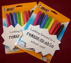 two bags of crayons with labels on them that say looking forward to remarkable school year