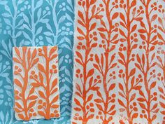 two pieces of fabric with orange and blue designs on them