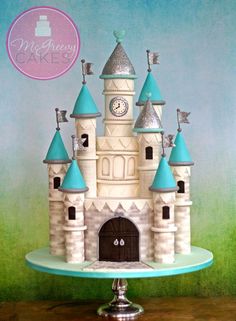 there is a cake that has been made to look like a castle with blue turrets