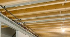 the inside of a building with wires and electrical equipment hanging from it's ceiling