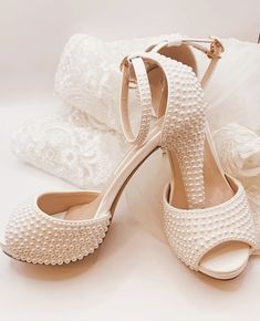 Simply Beautiful Hand Finished Ivory Pearl Embellished Open Toe Wedding Sandals with Ankle Strap and Platform Front Very Elegant Slight Platform for Added Comfort Perfect Wedding Day Shoe High for Elegance Perfect for Comfort Sizes: UK 3-7 (EU 36-41) Embellished Open Toe Sandals For Wedding, Cream Closed Toe Sandals For Wedding, Elegant Embellished Wedding Shoes For Bride, Embellished Open Toe Wedding Sandals, Elegant Open Toe Wedding Shoes For Bride, Embellished Closed Toe Sandals For Wedding, Elegant Open Toe Heels For Bride, White Open Toe Heels For Wedding Reception, White Heels With Pearl Embroidery For Formal Occasions