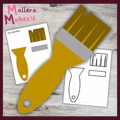 a yellow paint brush and some cut outs on a wooden background with the words mollers make it