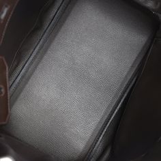 This Birkin is in Cafe clemence leather with palladium hardware and has tonal stitching, front flap, two straps with center toggle closure, clochette with lock and two keys, and double rolled handles.The interior is lined with Cafe chevre and has one zip pocket with an Hermes engraved zipper pull and an open pocket on the opposite side.Collection: N SquareOrigin: FranceCondition: Pre-owned; Excellent - This bag is slightly relaxed in shape. There's no plastic on the hardware resulting in visible scratches. The exterior leather has some signs of wear with minor press markings to the front leather and wear on the bottom base of bag. The interior leather has some light scuff marks to the interior base and discoloration spots to the interior leather.Accompanied by: Hermes dustbag, clochette, l Hermes Birkin 35, Hermes Birkin 25, Birkin 25, Hermes Birkin, Zip Pockets, Leather