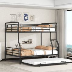 a bunk bed with two sets of mattresses on the bottom, and a trundle bed underneath