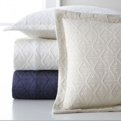 three pillows stacked on top of each other