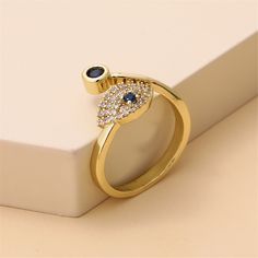 Add the finishing touches to your dazzle with this dainty ring showcasing colorful cubic zirconia for extra shine. 0.24"" W Goldtone copper / cubic zirconia Bypass Ring, Cards Sign, Eye Art, Dainty Ring, Phone Ring, Sapphire Ring, Cubic Zirconia, Gold Tones, 18k Gold