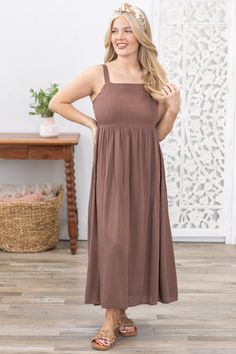 Product Details Colors: Dark Taupe Print: Solid Neckline: Square Neck Sleeve: Sleeveless Hemline: Straight Brand: Be Cool Material and Care Self: 100% Rayon Lining: 100% Polyester Hand Wash Cold Hang/Line Dry Size and Fit Adjustable Straps Small: Bust 28" Waist 27" Length 51" Medium: Bust 30" Waist 29" Length 51.5" Large: Bust 32" Waist 31" Length 52" Photo model is 5'4 and wearing a size medium Video model is 5’8 and wearing size small Dark Taupe, Photo Model, Be Cool, Large Bust, Small Bust, Square Neck, Smocking, Adjustable Straps, Hand Wash