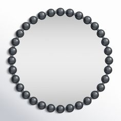 a black beaded necklace on a white background with an empty space in the middle