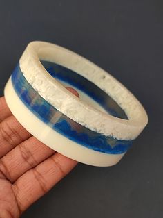 you will receive 1 piece of Resin Jewelry Trends Blue Color Bangle wide Bracelet Resin Art Purely Handcrafted Exclusive Stacking Bohemian Unique Vintage Style Jewelry Inner diameter: 2.6" Approx.  Thank you very much for visiting! Any questions, please feel free to contact us. Discount for bulk provide. Blue Handmade Wearable Art Bracelets, Blue Handmade Wearable Art Bracelet, Unique Handmade Blue Bangle, Blue Resin Bracelets As Gifts, Blue Resin Bracelets For Gifts, Blue Resin Bracelets For Gift, Artisan Blue Bangle Cuff Bracelet, Blue Resin Bracelets Perfect For Gifts, Artisan Blue Cuff Bangle Bracelet