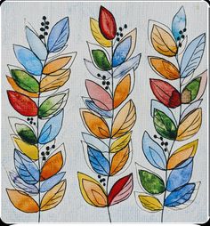 three colorful leaves painted on white paper