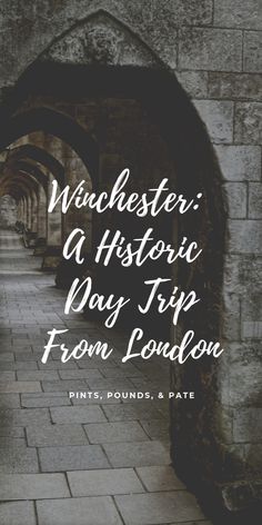 an archway with the words winchester, a historic way trip from london on it's side