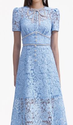 A calming vision in blue lace, this dress puts its rich floral textures on show with a universally flattering silhouette. Echo its diamanté bow with sparkling accessories at your next soirée. Main Fabric: 98% Polyester 2% Polyamide Lining: 100% PolyesterFitted style, take one size up if between sizesThis style has mini Formal Midi Dress With Delicate Lace, Evening Midi Dress With Delicate Lace, Delicate Lace Midi Dress For Formal Occasions, Elegant Midi Dress With Delicate Lace For Party, Spring Gala Midi Dress With Lace Trim, Elegant Mini Lace Dress With Lace Trim, Elegant Party Midi Dress With Delicate Lace, Chic Formal Dress With Delicate Lace, Formal Midi Lace Dress With Scalloped Lace