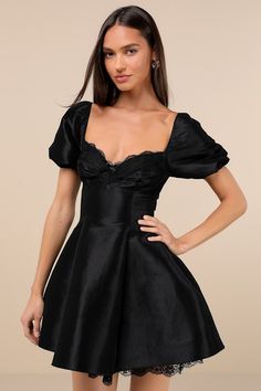 Charming and effortlessly captivating, the Lulus Enchanting Presence Black Taffeta Lace Puff Sleeve Mini Dress will have everyone entranced by the end of the night! Structured woven taffeta shapes a flirty sweetheart neckline and a lace-trimmed bodice with an under-bust seam, ruched detailing, and a cute bow at the center, all framed by short puff sleeves (with elastic at the shoulders and cuffs). The fit-and-flare silhouette continues down to a skater-style skirt that finishes at a mini hem wit Black Short Wedding Dress, Birthday Outfit For Winter, Short Black Wedding Dress, Homecoming Black Dress, Short Winter Dress, Black Dress Graduation, Short Black Bridesmaid Dresses, Banquet Outfit, Senior Banquet