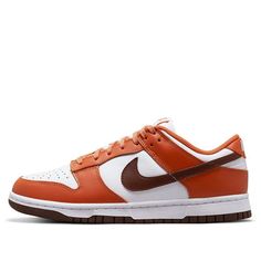 Looking for a classic sneaker with a twist? Check out the Nike women’s Dunk Low ‘Bronze Eclipse’. This sneaker features a white leather upper with brown and burnt orange overlays. The brown Swoosh really pops against the white background, and the burnt orange detail adds a touch of autumnal flair. The rubber cupsole is traditional and comfortable, and the grippy brown outsole gives you the traction you need. Whether you’re hitting the gym or running errands, this sneaker is a great choice. (SNKR Sneaker Outfits Women, Orange Shoes, Brown Sneakers, Sneakers Outfit, Nike Dunk Low, Classic Sneakers, Cute Simple Outfits, Dunk Low, Nike Dunk