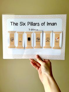 the six pillars of iman magnets are shown in front of a yellow wall