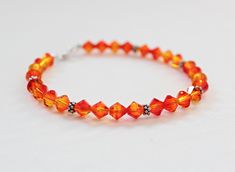 This beautiful orange crystal bracelet is handcrafted by me. Perfect orange bridesmaid or prom jewelry! Fire opal 6mm Swarovski crystals and Bali sterling silver are showcased in this bracelet. Perfect gift for an orange lover! Handmade by me in my smoke-free home. I represent the colors in photos as closely as possible. Please be aware that all monitors differ. I ship via USPS first class mail worldwide. Check out my other designs! http://www.etsy.com/shop/LeaningTreeDesigns Thanks for stopping Jewelry Valentines Day, Orange Bridesmaid, Orange Jewelry, Orange Bracelet, Fairy Jewelry, Orange Crystals, Prom Jewelry, Orange Wedding, Female Clothing