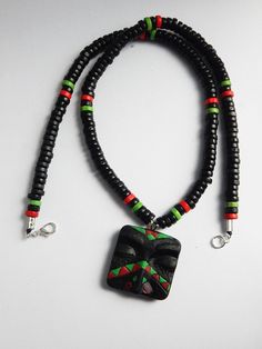 RBG Mens African Necklace RBG Mask Pendant by TheBlackerTheBerry Hand Painted Black Polymer Clay Jewelry, Adjustable Hand Painted Black Necklace, Adjustable Black Artisan Beads, Polymer Clay Face, Necklaces Red, African Beads Necklace, Mens Beaded Necklaces, Pan African, Red Black Green