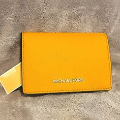 Michael Kors Jet Set Medium Slim Leather Wallet In A Lovely Yellow Color (Sun). Snap Closure, Tons On Room For 5-6 Cards, A Coin Purse, Clear Id Slot, And A Few Extra Hidden Areas Brand New With Tags Yellow Wallet With Removable Pouch For Daily Use, Yellow Travel Bags With Card Slots, Yellow Leather Travel Wallets, Yellow Bags With Interior Card Slots For Everyday Use, Yellow Rectangular Wallet With Removable Pouch, Yellow Leather Rectangular Wallet, Yellow Rectangular Wallet For Everyday Use, Rectangular Yellow Wallets For Everyday Use, Yellow Rectangular Wallets For Everyday Use