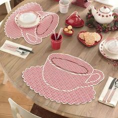 the table is set with red and white placemats