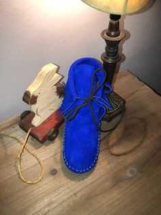 These handmade moccasins will not disappoint.  A vibrant royal blue suede handcrafted into a quality pair of moccasins.  They are also lined in leather (ideal for grounding).  This can be substituted for a faux Sherpa pad for added warmth and comfort. Blue Moccasins With Leather Sole And Moc Toe, Blue Moc Toe Moccasins With Stitched Sole, Blue Suede Moccasins With Rubber Sole, Blue Leather-sole Moccasins With Round Toe, Blue Leather Sole Moccasins With Round Toe, Blue Moccasins With Leather Sole And Round Toe, Blue Leather Moc Toe Moccasins, Blue Suede Moccasins With Stitched Sole, Blue Slip-on Moccasins With Suede Lining