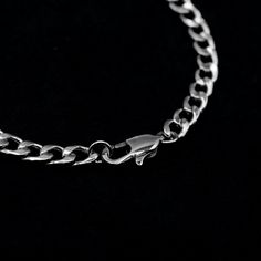 A Classic minimalist stainless steel Cuban Link Bracelet 5mm Width 316 Stainless Steel Non Tarnish & Water Resistant Hypoallergenic, no Irritation or Green Skin Optional Adjustable Extender Chain Hand Made in the UK Minimalist Silver Stainless Steel Chain Bracelet, Minimalist Silver Chain Bracelet With Stainless Steel Clasp, Silver Chain Link Minimalist Charm Bracelet, Silver Cuban Link Bracelet With Adjustable Chain, Silver Cuban Link Bracelet Gift, Silver Minimalist Chain Link Charm Bracelet, Silver Cuban Link Bracelet, Tarnish Resistant For Everyday, Minimalist Silver Chain Link Charm Bracelet, Minimalist Silver Charm Bracelet With Chain