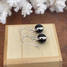 Sterling silver polished round black onyx ball dangle earrings. Black onyx contrasts nicely against the polished sterling silver. Length: 22.98mm Width: 8.97mm Weight: 2.81g French wires 925 sterling silver purity Saint Jewelry, Lightweight Earrings, French Wire, Earrings Black, Gold Polish, Light Weight Earrings, Hook Earrings, Gold Plated Sterling Silver, Black Onyx