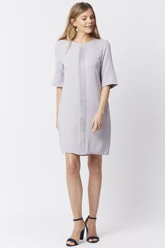 This stunning shift dress comes in a variety of shades and is cut to sit slim through the body with a high neckline and bell sleeves. A timeless and versatile take on smart dressing, style this piece with knee-high boots and a tote bag.  Silk blend    One size   Comfortably fits sizes 8 - 14 depending on desired fit. Smart Dressing, Cashmere Gloves, Dressing Style, Maxi Coat, Suede Coat, Gray Silk, Oversized Dress, Print Coat, Feather Dress