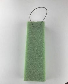 a piece of green felt sitting on top of a table