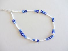 a blue and white beaded bracelet with beads