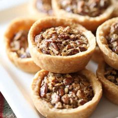 some pecan pies are on a white plate