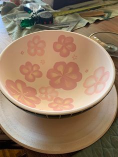 a bowl sitting on top of a wooden table