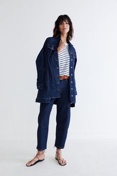 This longer take on the typical denim jacket makes for a stylish top layer for any look, smart of casual. Pair with the Denim Barrel Leg Pants for a bold denim vibe. Button down Hits at the thigh Side and breast pockets Collared Long Denim Jacket, Dressy Pants, Indigo Colour, Stylish Top, Great Lengths, Dark Indigo, Wide Leg Denim, Fashion Help, Silk Top