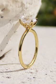 a close up of a ring on a rock