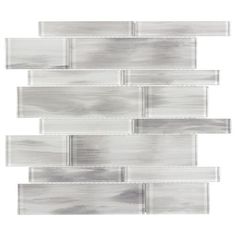 Crystal glass mosaic wall tile is strong, durable, and resistant to moisture Hand painted marbleized glass in white and soft greys offers a splash of distinction to your space This one of a kind linear mosaic offers a clean, crisp and beautiful variations of color Impervious tile doesn’t absorb water and is safe for use in settings with high-moisture Suitable for interior and exterior residential and commercial walls when proper installation methods are followed To help maintain a clean, beautiful surface, clean with a soft cloth or sponge with warm water or any non-abrasive mild detergent 11.81-in W x 11.81-in L x 8mm thick individual tile covers 0.97-sq ft This tile is suitable for use primarily on interior and exterior walls, such as kitchen and bathroom walls, fireplace exteriors, wet Transitional Tile, Unsanded Grout, Tile Covers, Patio Wall, Mosaic Wall Tiles, Interior Floor, Glass Mosaic Tiles, Grey Glass, Beach Cottage