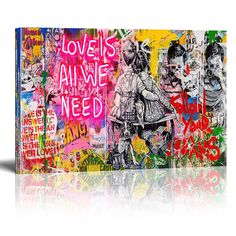 a large piece of art with graffiti on it's sides and the words love is all we need